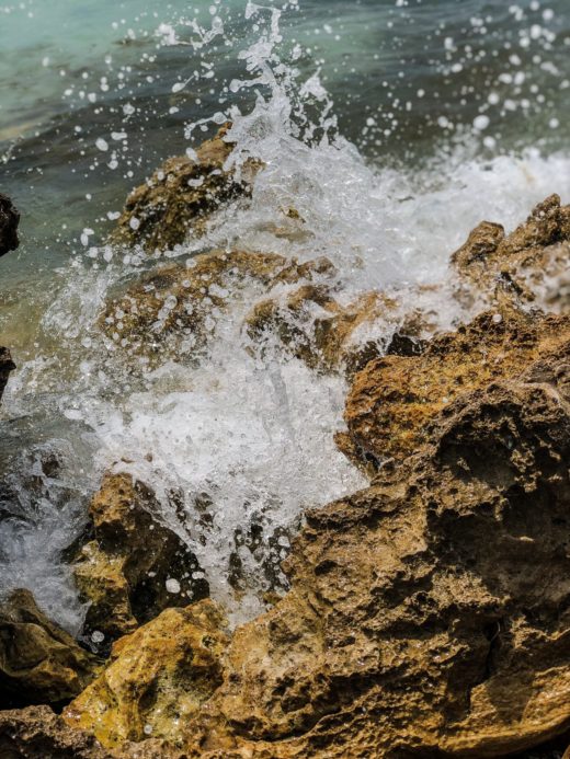 water crashing on rocks